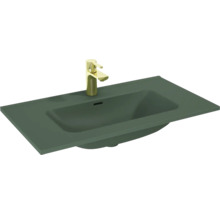 Aufgesetztes Waschbecken mit goldener Armatur