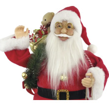 Dekorativer Weihnachtsmann mit Geschenkesack und Teddybär