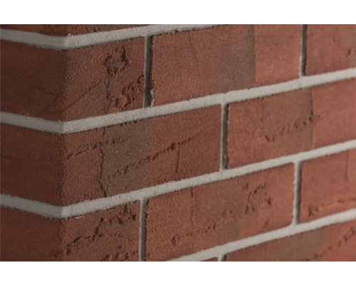 Eckriemchen Elabrick Cordoba 24x5,2 cm nuance rot Nahaufnahme einer Backsteinmauer mit Fugen