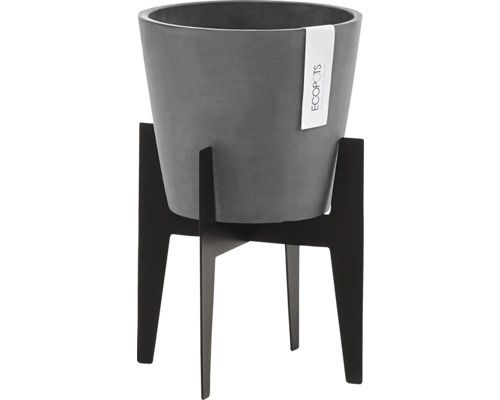 Grauer Blumentopf auf schwarzem Pflanzenständer