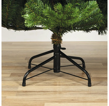 Detailaufnahme eines künstlichen Weihnachtsbaums mit Metallfuß.