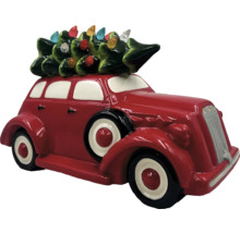 Dekoratives rotes Oldtimer-Auto mit Weihnachtsbaum auf dem Dach als saisonale Dekoration