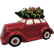 Dekorative rote Auto Figur mit Weihnachtsbaum auf dem Dach.
