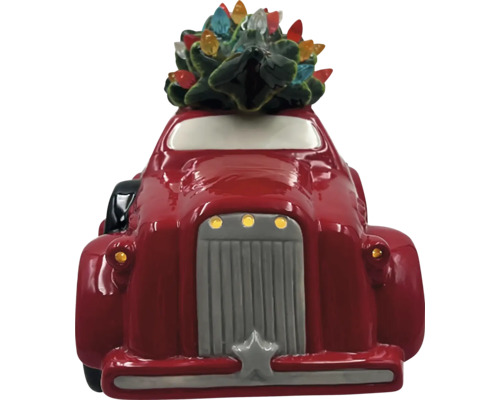 Dekoratives rotes Auto mit Weihnachtsbaum und Lichtern