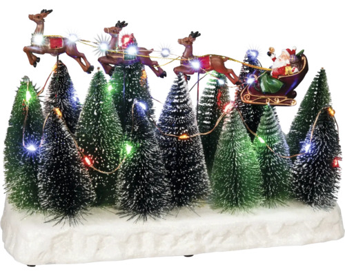 LED Szenerie Konstsmide Weihnachtsschlitten über Wald H 21,5 cm Zuleitungslänge 1,8 m 32 LEDs Lichtfarbe bunt batteriebetrieben inkl. 8 Stunden Timer Dekoratives Weihnachtsdorf mit Weihnachtsmann im Schlitten, gezogen von Rentieren, inmitten von beleuchteten Tannenbäumen.