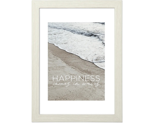 Gerahmtes Bild mit dem Aufdruck ''Happiness comes in waves'', das eine Welle am Strand zeigt