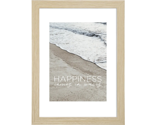 Gerahmtes Strandbild mit dem Schriftzug Happiness comes in waves