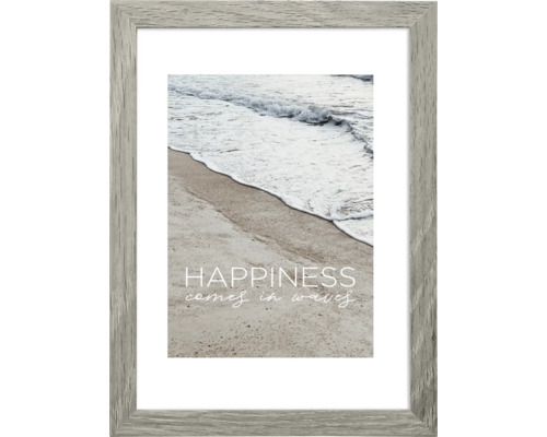 Gerahmtes Bild mit Strandmotiv und dem Spruch ''Happiness comes in waves''
