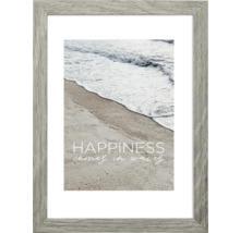 Gerahmtes Poster mit einem Strandmotiv und dem Text ''Happiness comes in waves''.