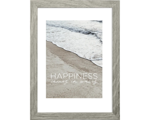 Gerahmtes Poster mit einem Strandmotiv und dem Text ''Happiness comes in waves''.