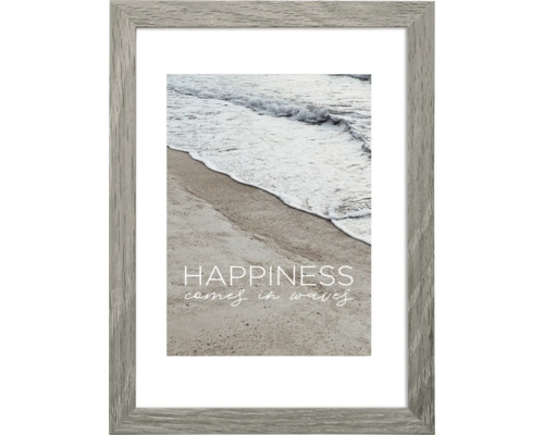 Gerahmtes Bild mit dem Text ''Glück kommt in Wellen'' und einer Fotografie von Strand und Meer