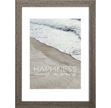 Gerahmtes Bild mit dem Motiv einer Küstenlandschaft und dem Spruch ''Happiness comes in waves''.