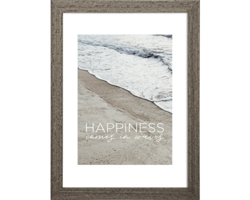 Gerahmtes Bild mit dem Motiv einer Küstenlandschaft und dem Spruch ''Happiness comes in waves''.