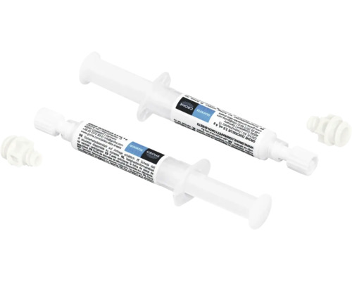 Zwei Grohe QuickGlue Klebstoffspritzen mit Dosierspitzen