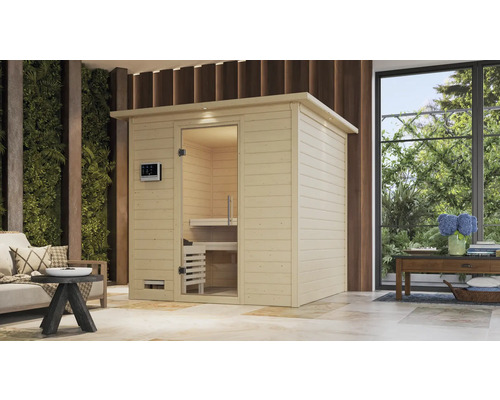 Massivholzsauna Karibu Wojave inkl. 9 kW Ofen u.integr.Steuerung mit Dachkranz und Ganzglastüre aus Klarglas Holzsauna mit Glastür in einem hellen Raum
