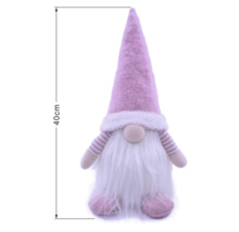 Dekorativer rosa Wichtel mit weißem Bart und spitzer Mütze, Höhe 40 Zentimeter.