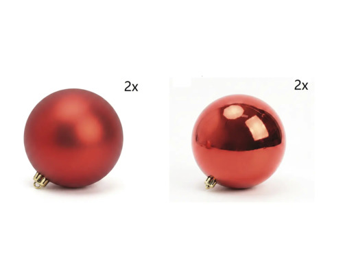 Zwei matte und zwei glänzende Weihnachtskugeln.